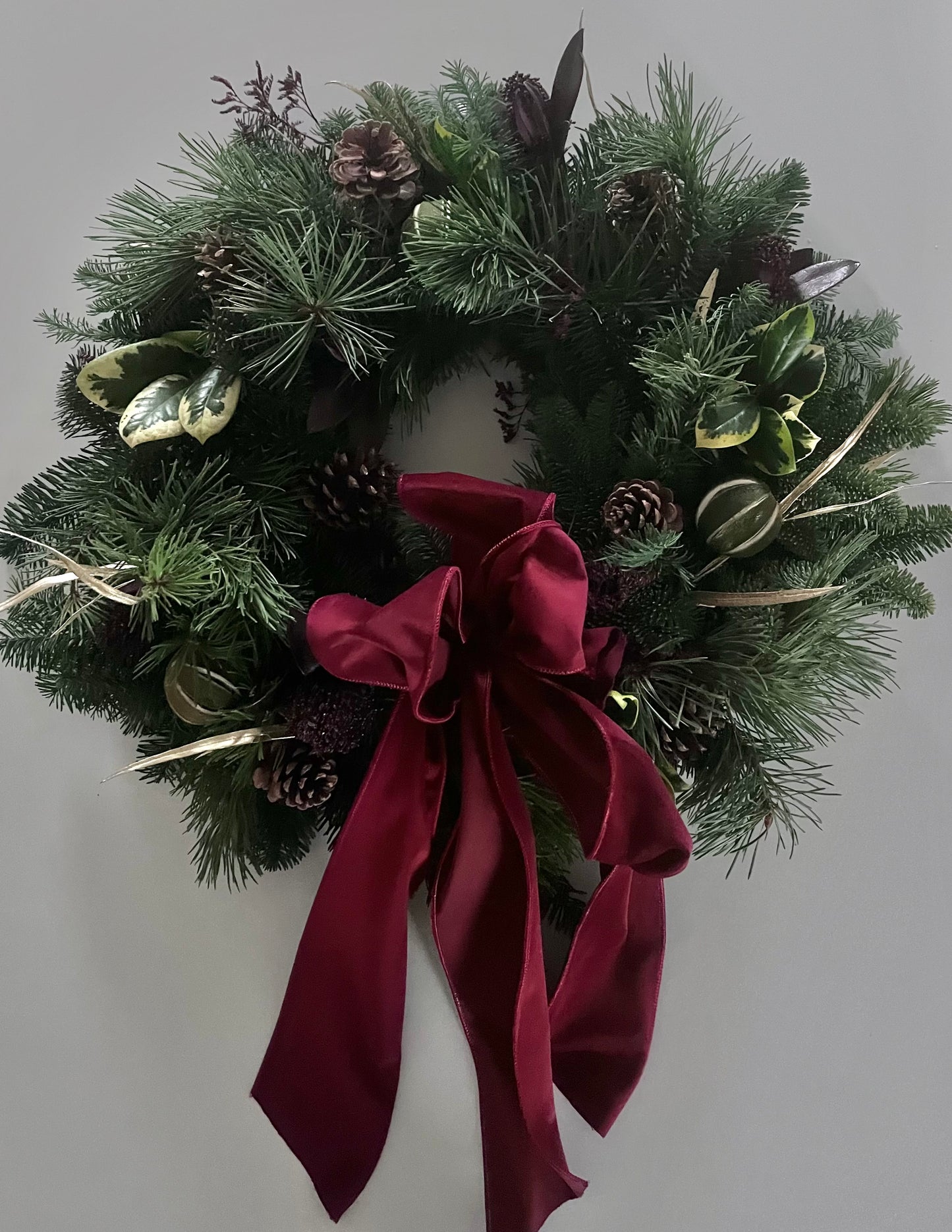 Fresh mixed foliage luxury wreath with wide velvet bow